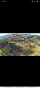 an aerial view of the plains and mountains from an airplane at Casa vicente in Santa Cruz das Flores