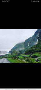 a picture of a mountain with a road next to it at Casa vicente in Santa Cruz das Flores