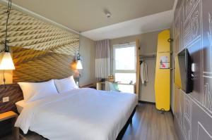 Ein Bett oder Betten in einem Zimmer der Unterkunft Ibis Muenchen City Ost