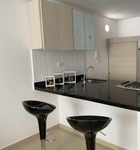 Ett kök eller pentry på Hermoso Apartamento Con Piscina
