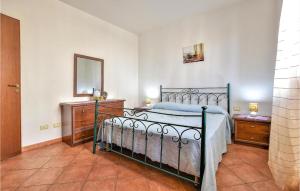 a bedroom with a bed and two dressers and a mirror at Casa Antonella in San Vito lo Capo