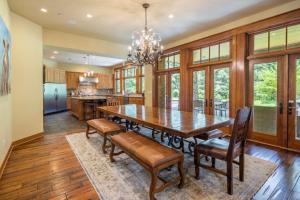a dining room with a wooden table and chairs at Family Home, Hot Tub, Suncadia Pool Access in Cle Elum