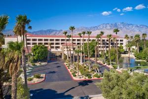 an aerial view of a hotel with palm trees at DoubleTree by Hilton Golf Resort Palm Springs in Cathedral City