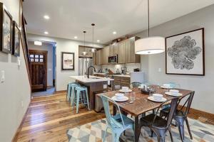a kitchen and dining room with a table and chairs at Great Location Near Pool with Suncadia Pool Access in Cle Elum