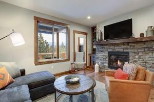 a living room with a couch and a fireplace at Great Location Near Pool with Suncadia Pool Access in Cle Elum