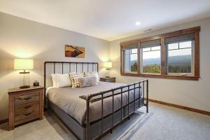 a bedroom with a bed and a window at Great Location Near Pool with Suncadia Pool Access in Cle Elum +30 photos