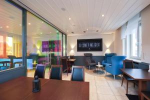 TV a/nebo společenská místnost v ubytování Arthotel ANA Flair