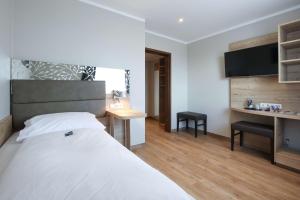 Postel nebo postele na pokoji v ubytování Arthotel ANA Flair