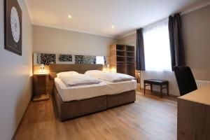 Postel nebo postele na pokoji v ubytování Arthotel ANA Flair