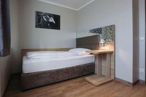 Postel nebo postele na pokoji v ubytování Arthotel ANA Flair