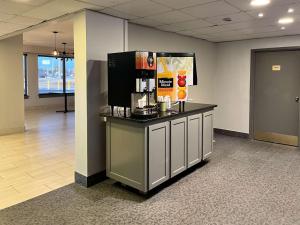 a lobby with a counter with a coffee maker on it at Motel 6 Montgomery, AL - Eastern Blvd. in Montgomery