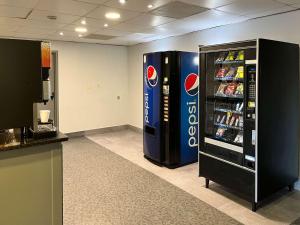 a large soda vending machine in a room at Motel 6 Montgomery, AL - Eastern Blvd. in Montgomery
