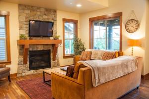 a living room with a couch and a fireplace at Great Location Near Pool with Suncadia Pool Access in Cle Elum