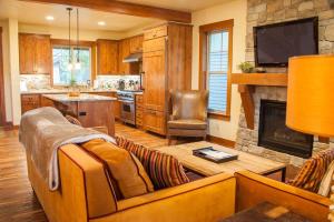 a living room with a couch and a fireplace at Great Location Near Pool with Suncadia Pool Access in Cle Elum