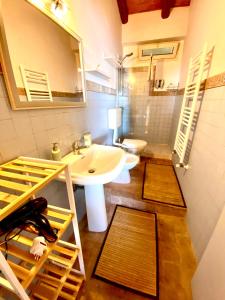 a bathroom with a sink and a mirror at Casa dei sogni in Taormina +24 photos