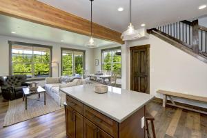 a kitchen and living room with a couch and a table at Great Location Near Pool with Suncadia Pool Access in Cle Elum