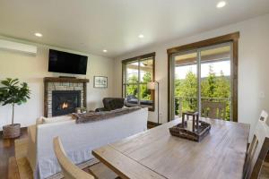 a living room with a couch and a fireplace at Great Location Near Pool with Suncadia Pool Access in Cle Elum