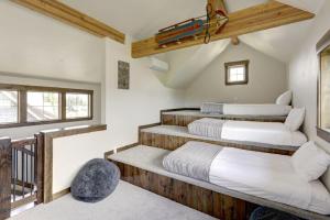 a bedroom with three beds and a balcony at Great Location Near Pool with Suncadia Pool Access in Cle Elum +34 photos