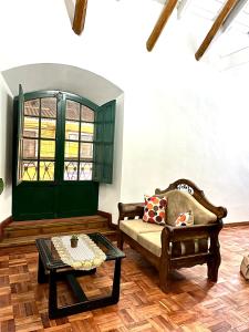 a living room with a couch and a table at Contando Historia in Potosí