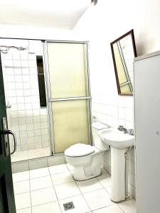 a bathroom with a toilet and a sink at Contando Historia in Potosí