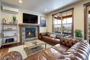 a living room with a couch and a fireplace at Great Location Near Pool with Suncadia Pool Access in Cle Elum