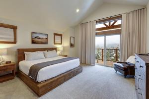 a bedroom with a bed and a large window at Great Location Near Pool with Suncadia Pool Access in Cle Elum +30 photos