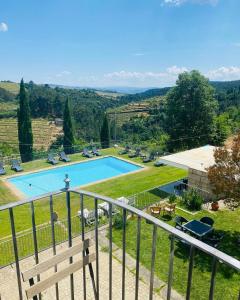 a view of a swimming pool from a balcony at Quinta de Fiães in Vilar de Maçada