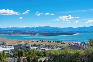 a view of a city and a body of water at Jacaranda - Views over Tasman Bay in Nelson