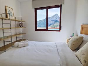 Cama o camas de una habitación en Apartamento Dúplex Aloha Calpe, primera línea de playa