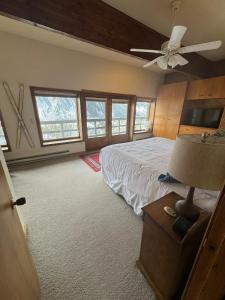 a bedroom with a bed and a ceiling fan at Mountain Summit Serenity Aspen Views Adventure in Aspen