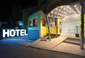 a hotel is lit up at night at Garni Hotel Crystal in Kraljevo
