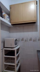 a small kitchen with a microwave on a counter at departamento tucuman 672 in Buenos Aires