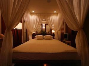 Un pat sau paturi într-o cameră la The Shinra