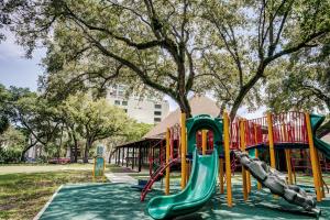 a playground with a slide in a park at Coconut Grove Gorgeous Bay View 1 bedroom Condo Includes Parking in Miami