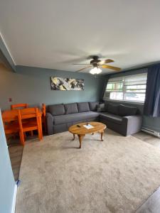a living room with a couch and a table at 23 B ST APARTMENTS in Hampton