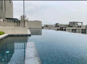 a large swimming pool on top of a building at Camelia youth city nilai studio residence 5 pax. in Nilai