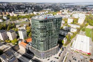 an aerial view of a tall building in a city at Hanza Tower Apartment no. 701 - Swimming pool, jacuzzi, terrace in Szczecin