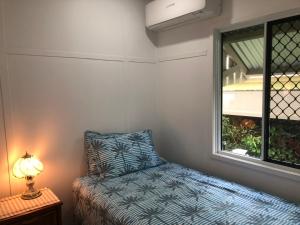 Katil atau katil-katil dalam bilik di Sandhills Cottage