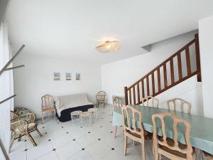 a living room with a table and chairs and a bed at Maison de ville à 50m de la plage et commerces, 2 chambres, cour mitoyenne - FR-1-361-114 in Bouillon