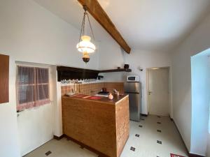 a kitchen with a counter top in a room at Studio 50 m² avec Jardin à 350 m de la Plage, Saint Brevin l’Océan - FR-1-364-158 in Saint-Brevin-les-Pins +7 photos
