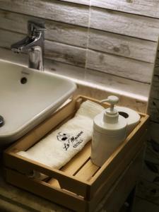 a bath tub with a sink and a towel at Cosy 2 bedrooms apartment with garden in Cairo