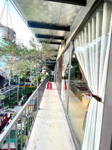 a balcony of a building with a view of a street at Lake view homestay in Pleiku