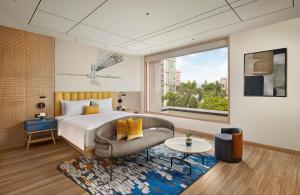 Postel nebo postele na pokoji v ubytování Hyatt Centric Ballygunge Kolkata