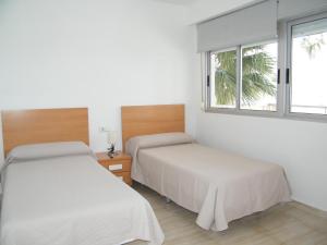 Ένα ή περισσότερα κρεβάτια σε δωμάτιο στο Apartamento Playa de Gandía, 4 dormitorios, 9 personas - ES-314-7