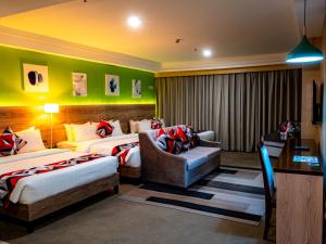 Postel nebo postele na pokoji v ubytování Kojo Hotels Cebu-Mandaue