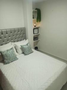 Un ou plusieurs lits dans un hébergement de l'établissement Apartamento céntrico en Cartagena
