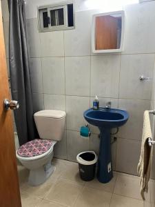 a small bathroom with a toilet and a sink at 0 es 3 Uno in Treinta y Tres