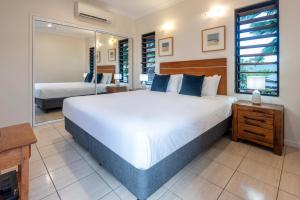 Postel nebo postele na pokoji v ubytování Anchorage Apartments on Hamilton Island by HIHA