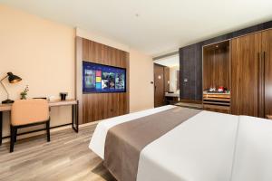 Voodi või voodid majutusasutuse HomeInn Selection Harbin Central Street Sophia Church toas