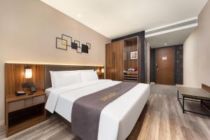 Voodi või voodid majutusasutuse HomeInn Selection Harbin Central Street Sophia Church toas
